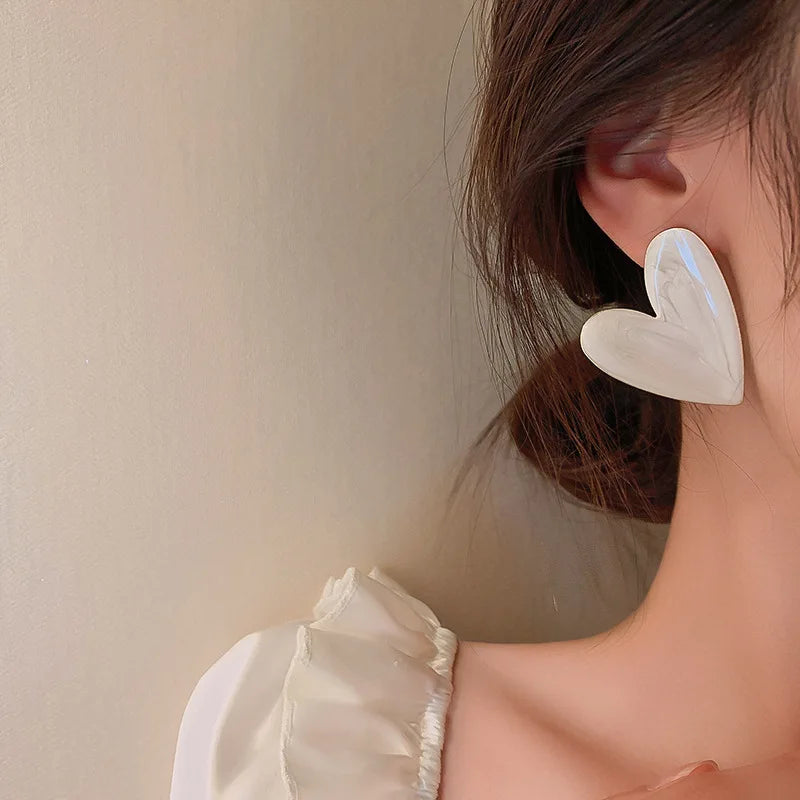 Herzförmige Ohrstecker - sunny.side-Productions